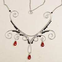 How to Make a Silver Wire Wrapped Necklace with Red Drop Glass Beads