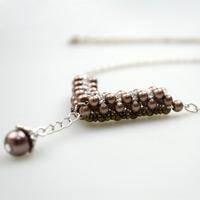 Make your own charm necklace out of several pearl beads and seed beads