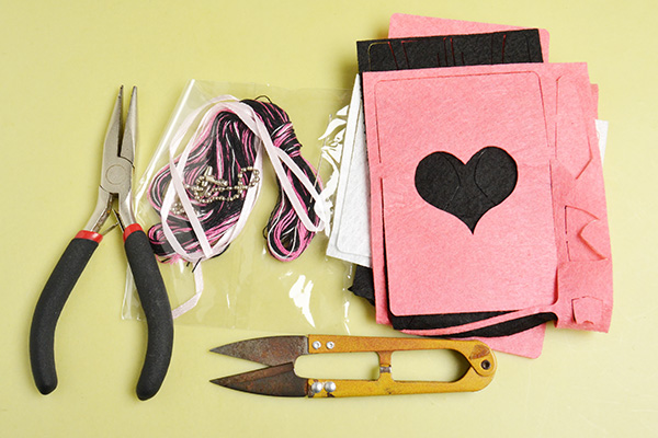 These materials and tools will be used to make the cute pink card holders: