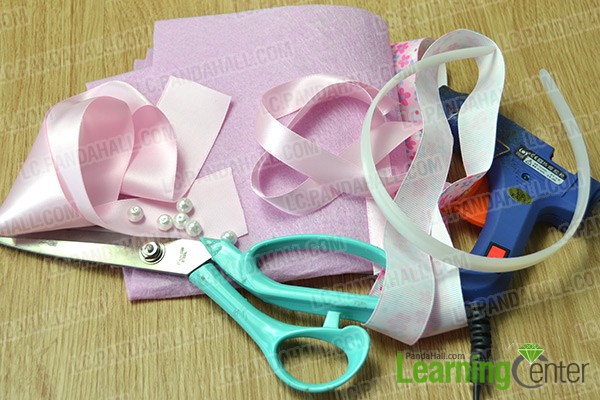 materials and tools for making a sweet pink ribbon flower headband
