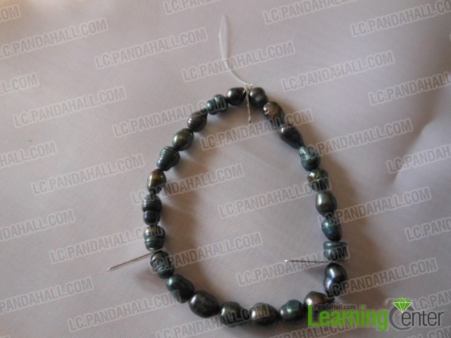 make first pearl circle by stringing beads and iron spacer to 