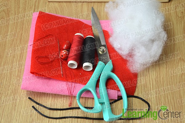 materials and tools for making a cute red hanging sachet bag