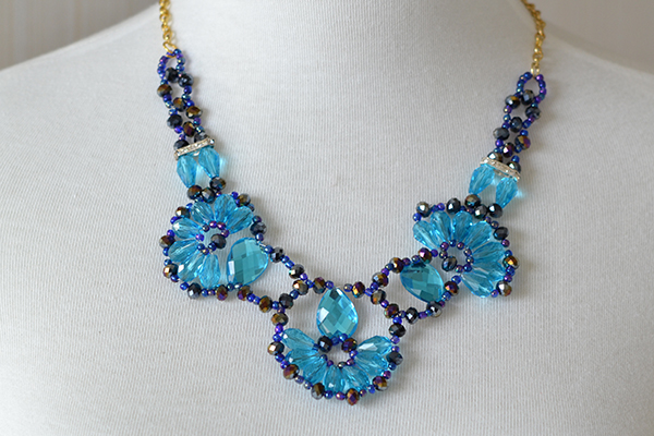 final look of the delicate blue charm necklace