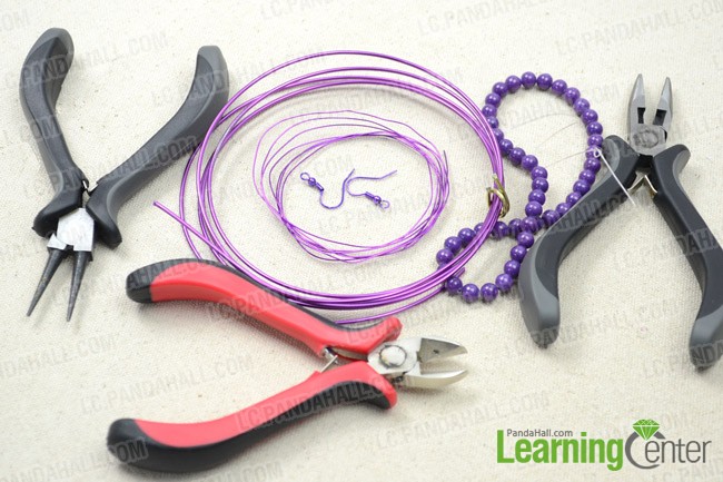 Materials and tools for wire wrapping purple vase earrings: