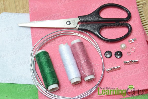 materials and tools for making a pink flower cuff bracelet