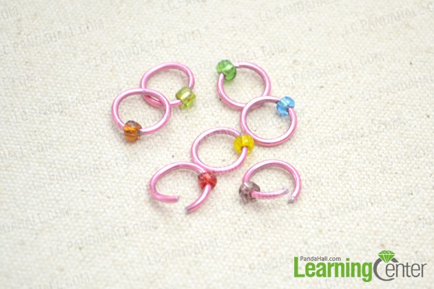 Slide the colorful seed bead onto medium-sized jumpring