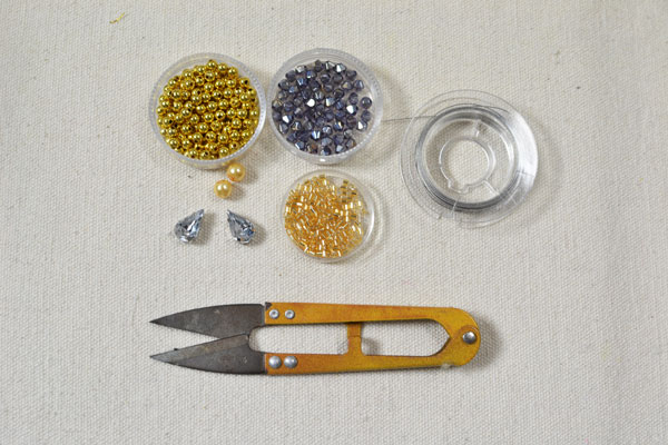 Supplies in making the rhinestone bow ring with glass beads ornaments: