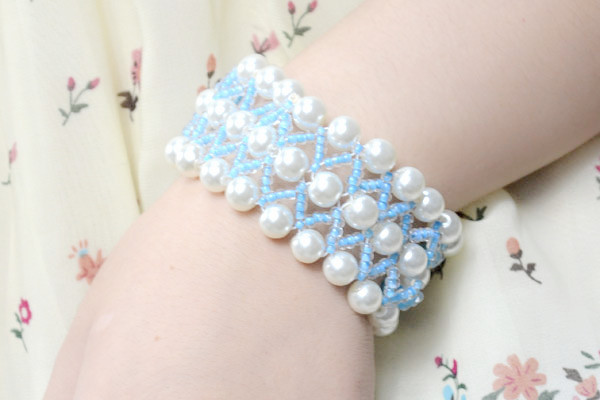 the final look of a pearl wedding cuff bracelet