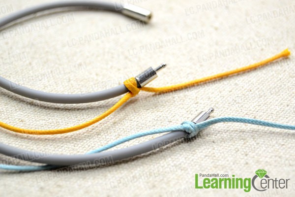 tie the orange cord onto another rubber band