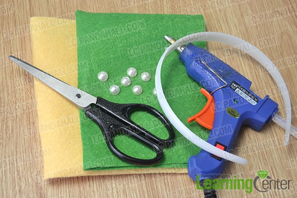 materials and tools for making a felt headband with green bows