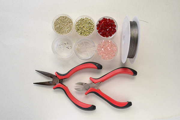 Supplies in making the red and pink crystal dancing clovers bracelet: