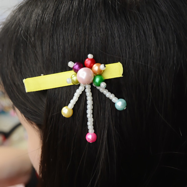 The final look of the rainbow pearl hair clips with yellow ribbon: