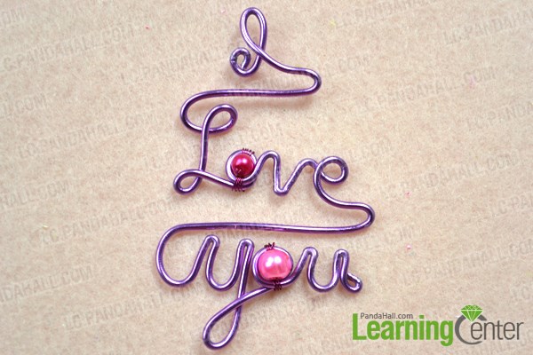 Add beads to the love letters for the DIY personalized necklace