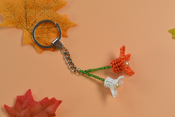 Now, you can see the final flower key chain with seed beads and pearl beads: