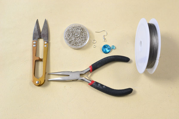 Supplies in making the beade snowflake earrings with blue rhinestone: