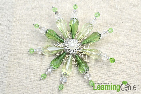 the  completed beaded snowflake brooch