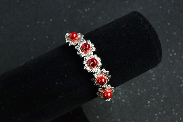 final look of the silver flower bangle bracelet with red pearl beads