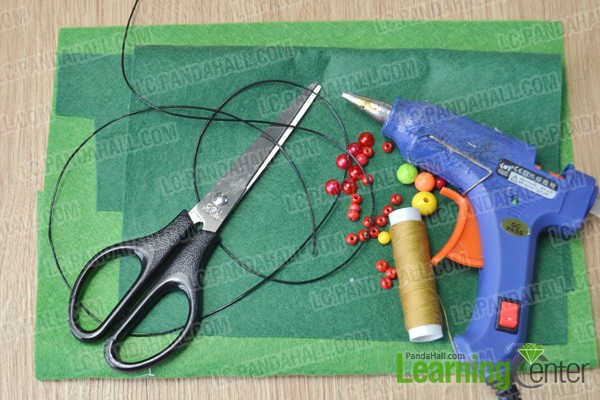 materials and tools for making a clover pendant necklace