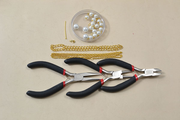 Materials and tools needed in making the gold chain necklace with pearl dangles: