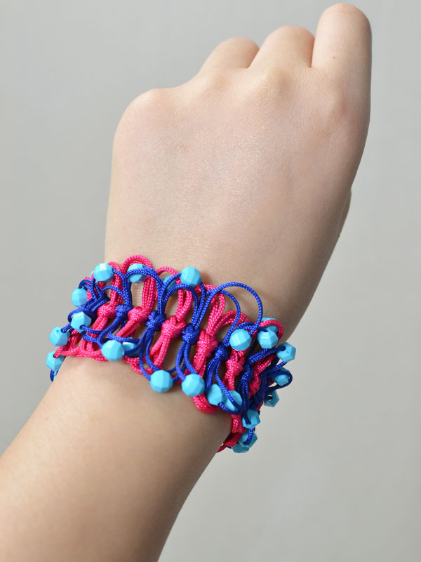 final look of the blue and red nylon thread braided friendship bracelet