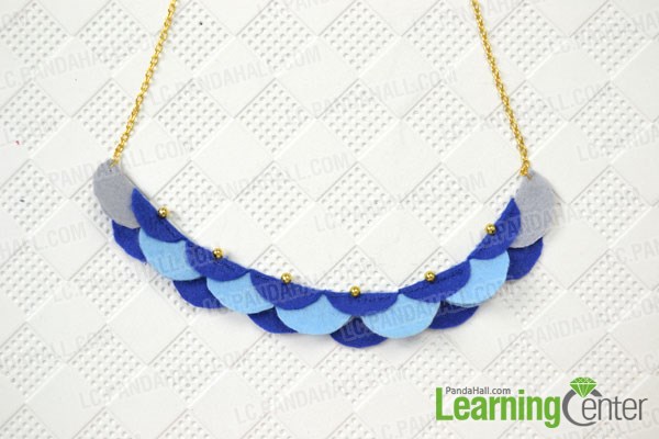 Attach the crescent to the chains of felt bead necklace