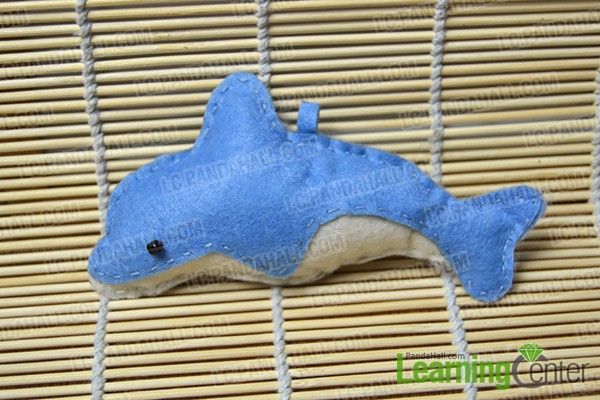 finished blue stuffed dolphin pendant