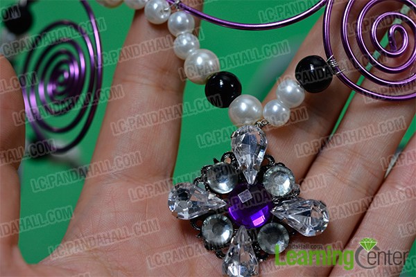 Finish the purple wire wrapped headpiece with rhinestone drop