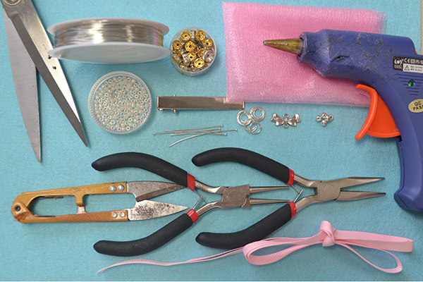 Supplies in the pink flower hair clip DIY: