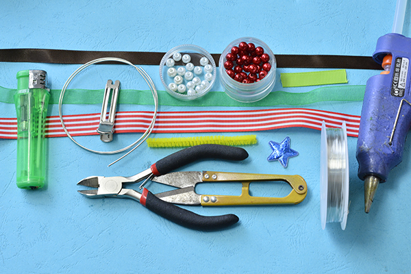 Materials and tools needed in making the cute Christmas hair clips for kids: