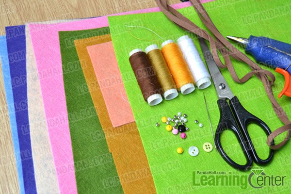materials and tools for making a felt flower bracelet