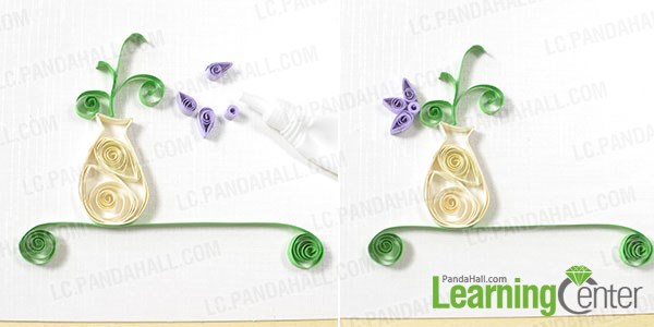 Add purple quilling paper flowers