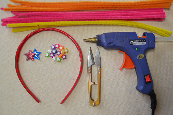 Materials and tools needed in the orange hair band craft: