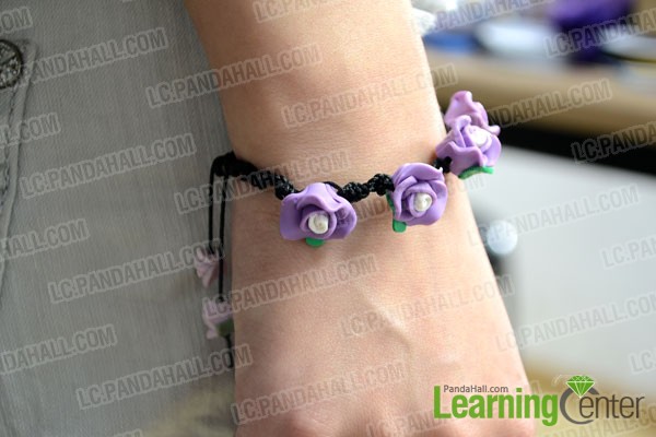 finished Spiral Knot Bracelet with Purple Polymer Clay Flower Beads